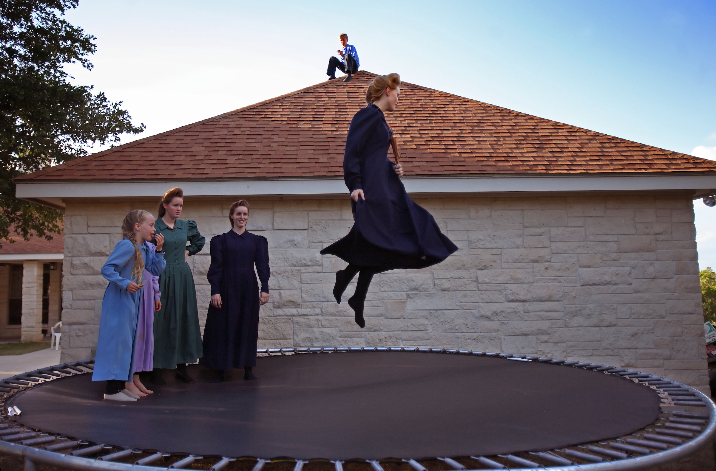 Teresa Jeffs, 16, daughter of jailed leader Warren S. Jeffs, plays on the family trampoline.